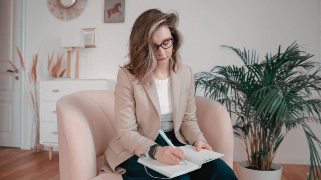 Clinician preparing an NHS Talking Therapies session - supporting RTT performance and workforce wellbeing.