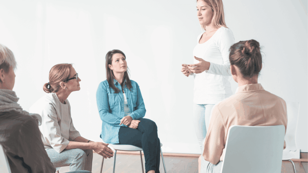 Clinicians collaborating in an NHS Talking Therapies service, representing aligned insourced teams working under shared governance.