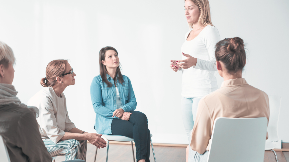 Clinicians collaborating in an NHS Talking Therapies service, representing aligned insourced teams working under shared governance.